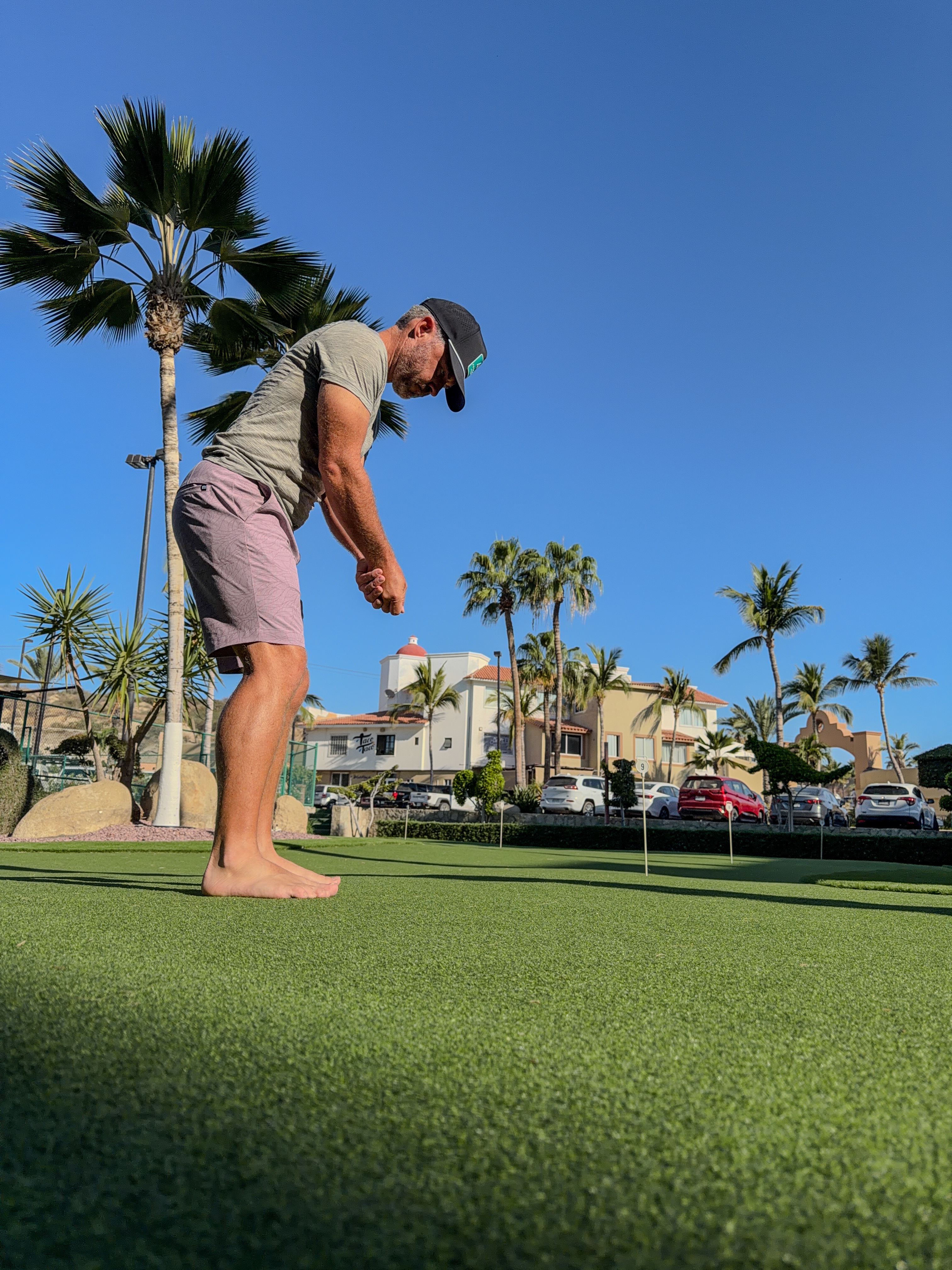 Example putting setup photo — stand naturally in your putting stance, full body visible from the side